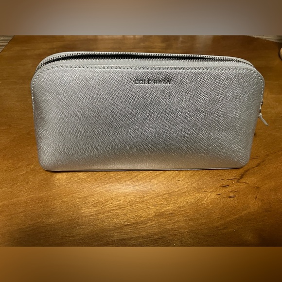 Cole Haan Handbags - Cole Haan Metallic Silver go anywhere leather case